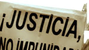 Pancarte de una protesta popular en la que se puede leer "Â¡Juastica No Impunidad!
